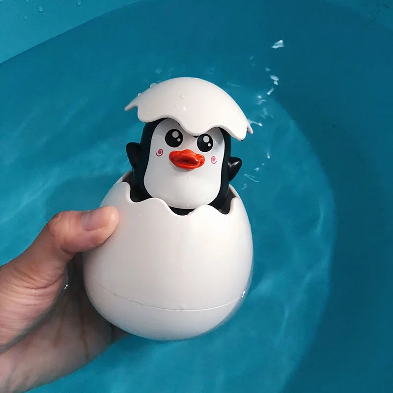jouet baignoire bebe oeuf de pingouin bleu
